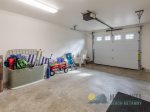 Garage with beach toys and extra chairs.